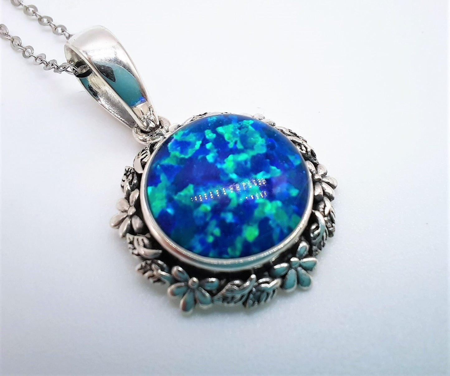 Handcrafted Iridescent Blue Opal Pendant Necklace - Flower and Leaf Design - Made with 925 Sterling Silver - Domed with Holographic Resin