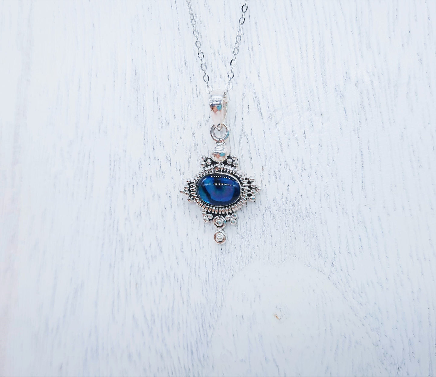Genuine Blue Abalone Shell 925 Sterling Silver Pendant Necklace with 8x6mm Cabochon Setting Covered with Holographic Powder Infused Resin